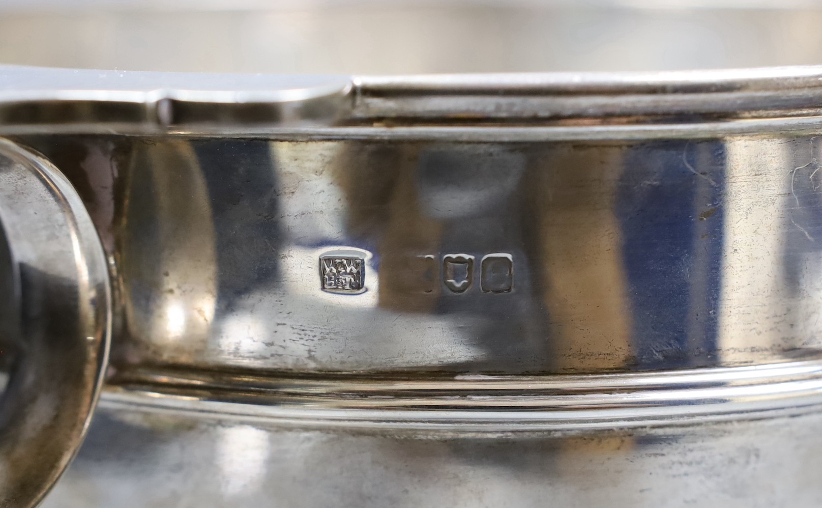 A late Victorian two handled silver rose bowl, with strapwork decoration and later presentation inscription, London 1900, 1532 grams, 35cm over handles, height 18cm